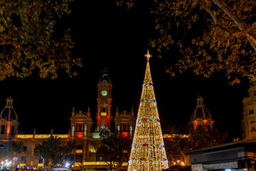 Valencia city hall square in Chrsitmas with Christmas tree in yellow colours