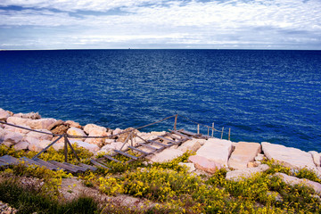 old wooden ladder on the sea