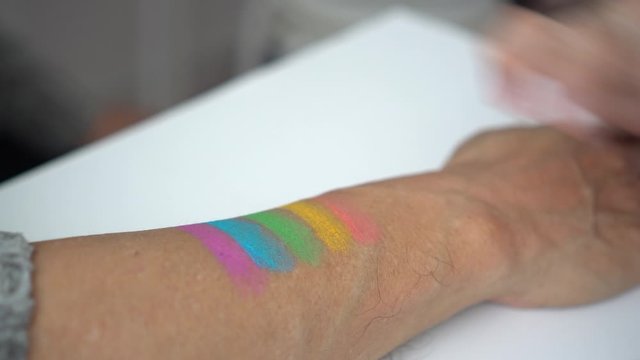 Senior couple paint rainbox pride symbol to go support LGBTQ parade together