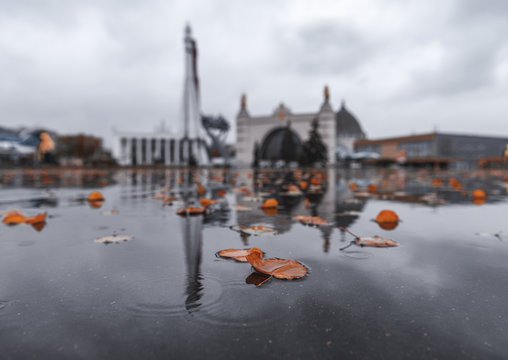 Space Pavilion in the fall. Reflection in the autumn park VDNH.