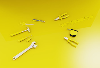 Many yellow hand tools on a yellow background, there is space for your ad in the center.