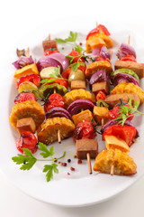 vegetarian barbecue skewer with corn, tomato, tofu and onion