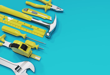Many  yellow hand tools on a blue background, there is space for your ad.