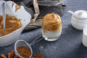 trendy dalgona coffee on grey background, korean coffee concept