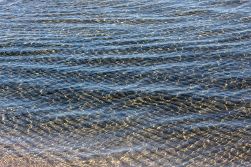 Nature as texture. Transparent seawater. A mood for relaxation.