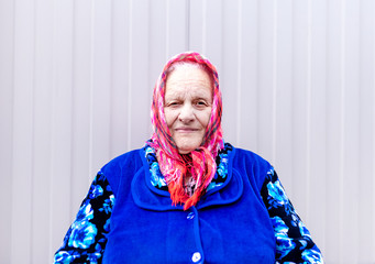 Portrait of an old grandmother in a scarf