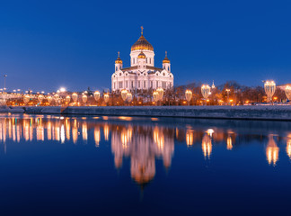 Fototapeta na wymiar Cathedral of Christ the Savior and its reflection in the river. New Year's night illumination of the city