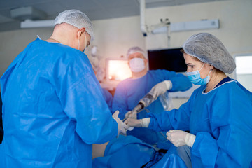 Modern surgical system. Process of surgery operation using medical equipment. Medical robot.