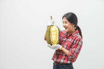 Portrait Asian young woman she smiling and looking holding durian fruit. Female farmer happy...
