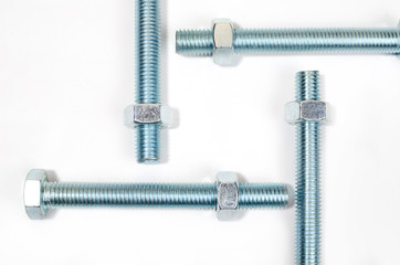 Bolts, steel galvanized with hex heads on white background