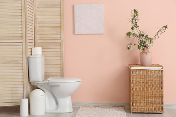 Fototapeta premium Interior of bathroom with fresh flowers