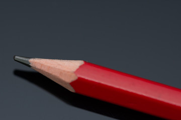 Red pencil in high resolution isolated on  black background ,Isolated graphite pencil