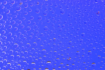 Drops background. Wet water on glass. Rain pattern texture.