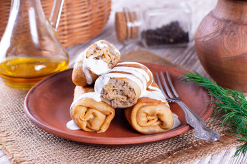 Stuffed pancakes crepes with meat and sauce