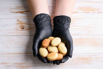 Homemade Russian nuts with condensed milk and mascarpone on a light blue background, wafer napkin....