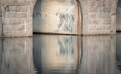 Stone bridge reflection on lake