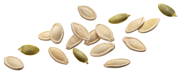 Falling pumpkin seeds isolated on white background