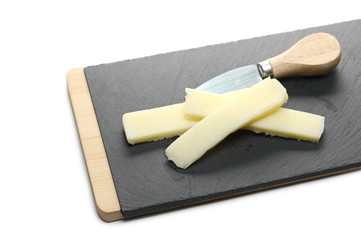 Wooden chopping board with small cheese knife isolated on white background