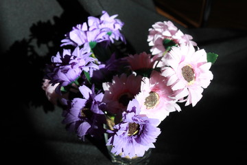 Bouquet of flowers in a vase on black