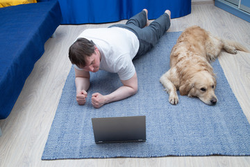 Online fitness classes at home. Using a laptop for classes.