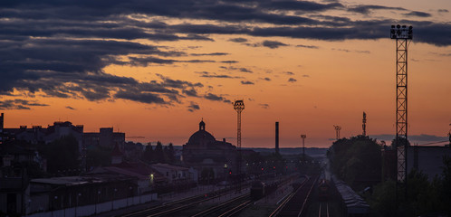 Fototapeta na wymiar Railway station at sunset in the Ukrainian city