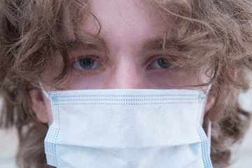 Protective medical mask on the person's face. Protection from the virus.