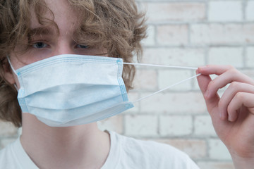 Protective medical mask on the person's face. Protection from the virus.
