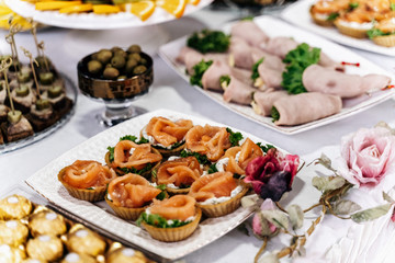 Tartlets with red fish next to bacon