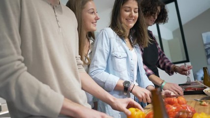 Flatmates cooking together at home