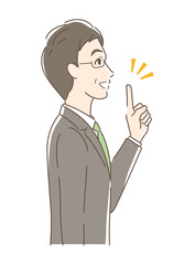 笑顔で指をさす男性の横顔