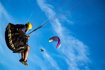 Paragliding with sunset sky and wind