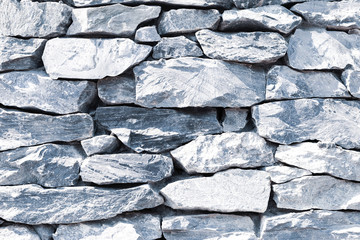 Stone background, grey stack stone, nature texture background, outdoor day light, nature material wall
