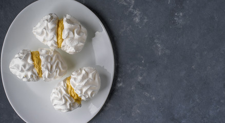 Bizete cakes on a white plate on a blue background
