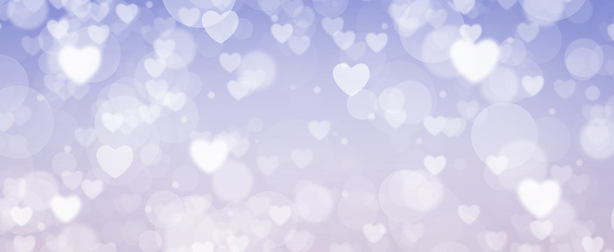 Glowing soft purple and blue bokeh background. Spring concept. Blurred bokeh circles and hearth shapes.
