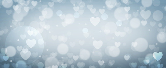 Glowing soft blue bokeh background. Spring concept. Blurred bokeh circles and hearth shapes.