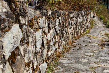 Pedestrian path along the stone wall. Nepal