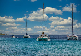 White yachts and sailboats moored off the coast of Bonaire