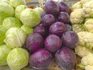 fresh vegetables on market stall cabbage Purple cabbage and cauliflower