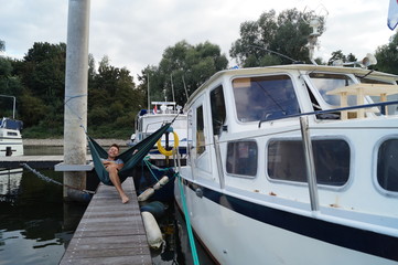 Fototapeta na wymiar hammock on a boat on a river
