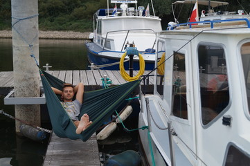 hammock on a boat on a river