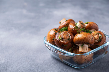 Champignon mushrooms marinated with olive oil and fennel ready to cook. Mushrooms reday to bbq....