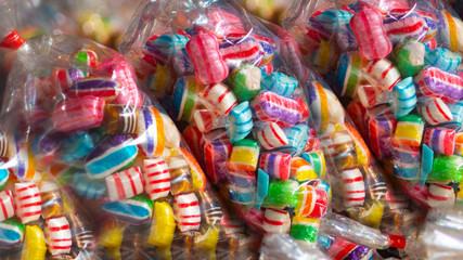 Fototapeta na wymiar Colorful candies in plastic packaging.