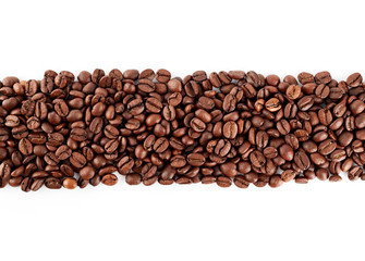 Roasted coffee beans on a white background. The texture of the coffee. An invigorating drink.