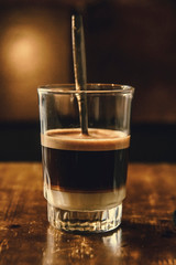 Vietnamese Milk Coffee on Wooden Table. Traditional Hot Drinks in Vietnam. Close-up Vietnamese Drip Coffee and Ice mug served with milk, Iced black coffee.