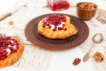 tartlet with berries, sweet pastries on a white table, pastry shop.