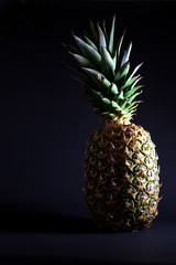 pineapple on a black background. exotic fruit. breakfast