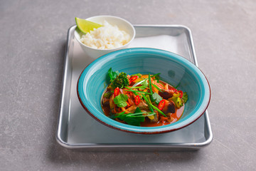 Colorful Asian meat and vegetable dish. Sweet and sour pork and mixed vegetable delicacy. Tasty dinner.