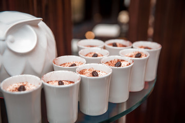 tiramisu in glasses and sandwiches cake in a glass