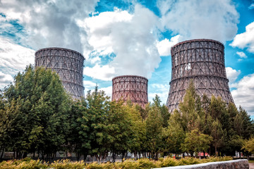 towers smoke trees sky clouds ecology
