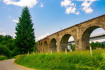 Fototapeta na wymiar Historical abandoned railway arch bridge viaduct in Vorokhta, Ivano-Frankivsk Region, Ukraine